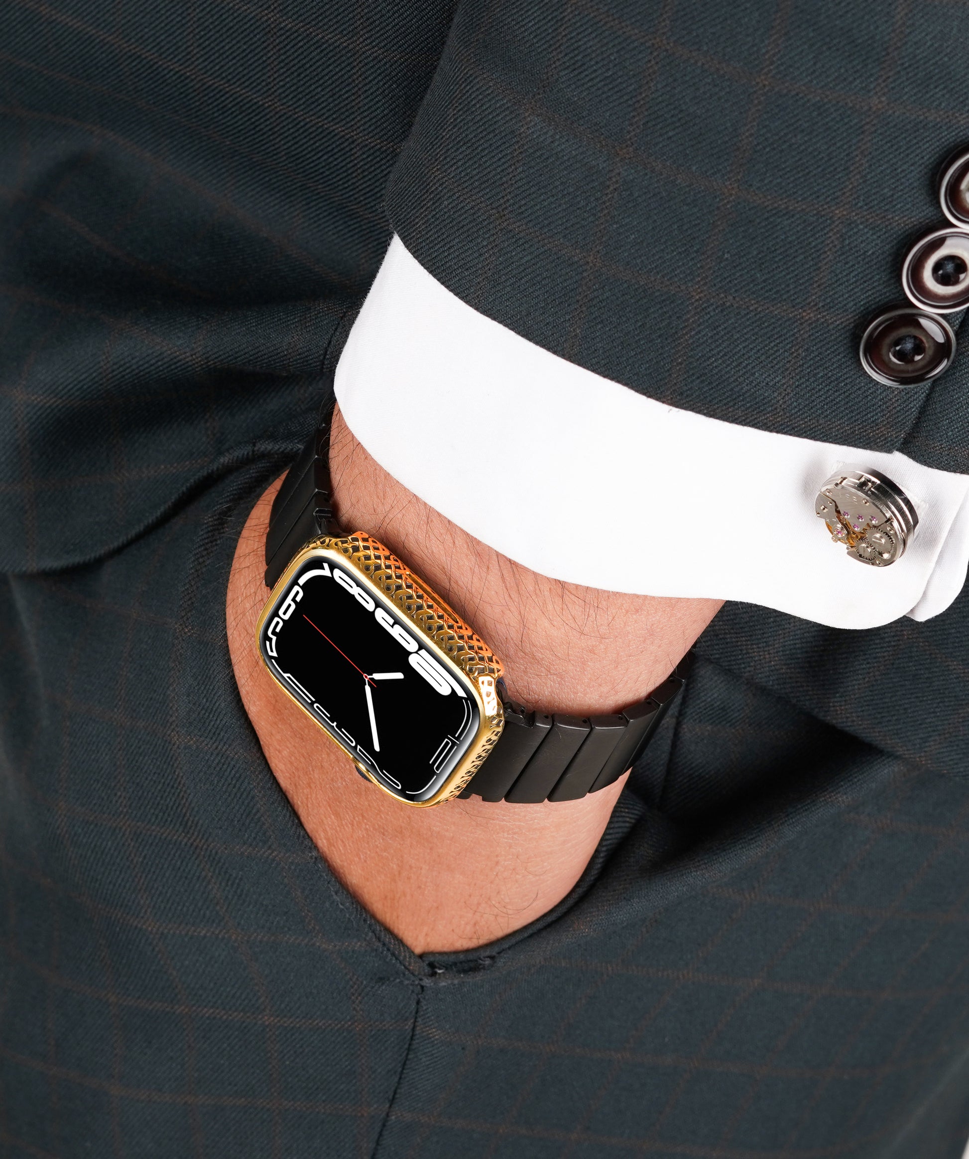 Apple Watch Series 9 silver case with custom design made from sterling silver with a PVD-coated gold finish, featuring hand-applied black enamel for a sleek and sophisticated design