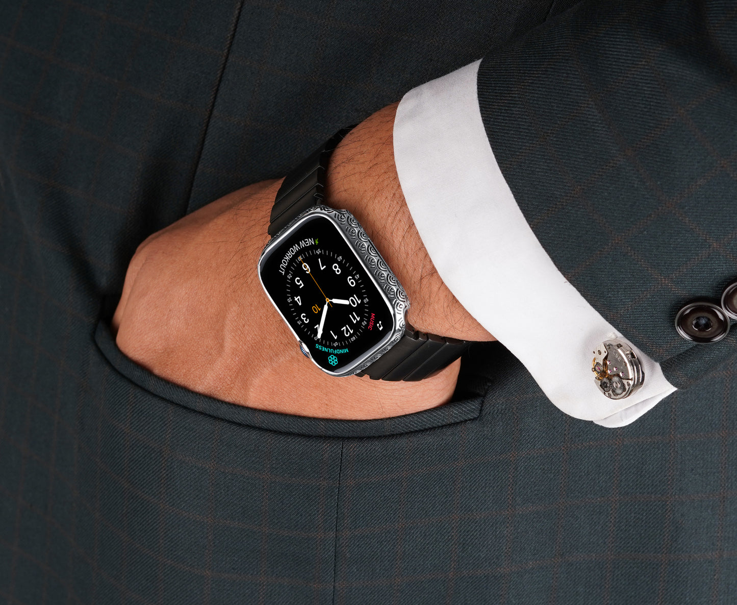 Apple Watch Series 9 silver case with custom design made from sterling silver with a PVD-coated silver finish, featuring hand-applied black enamel for a sleek and sophisticated design