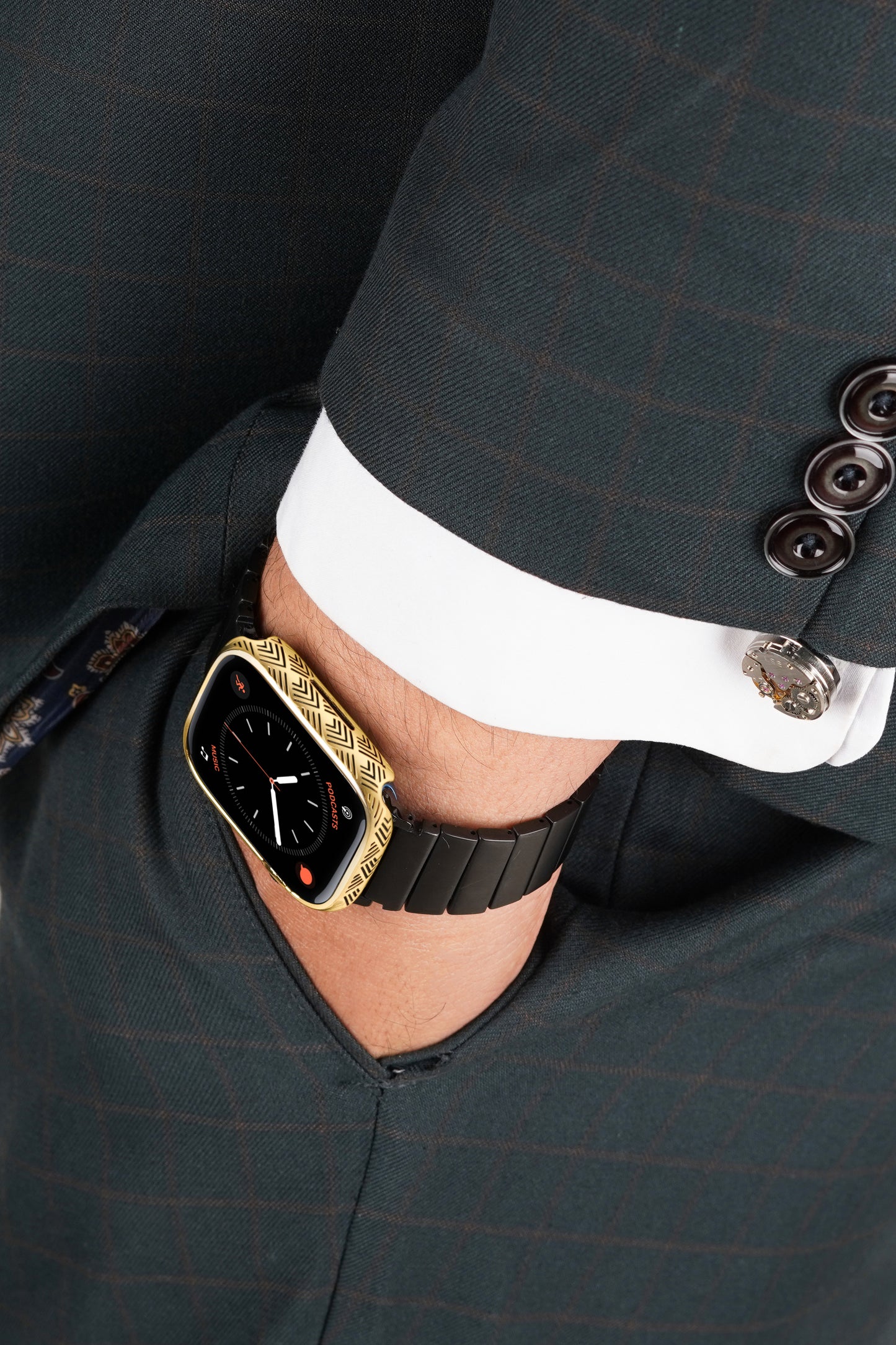 Apple Watch Series 9 silver case with custom design made from sterling silver with a PVD-coated gold finish, featuring hand-applied black enamel for a sleek and sophisticated design