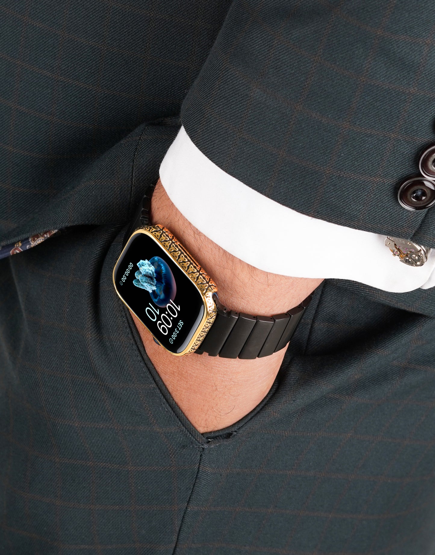 Apple Watch Series 9 silver case with custom design made from sterling silver with a PVD-coated gold finish, featuring hand-applied black enamel for a sleek and sophisticated design